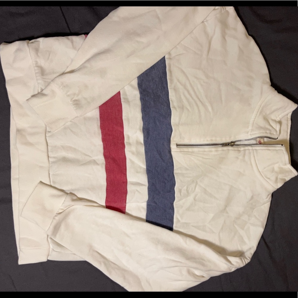 White quarter zip with a red and blue stripe